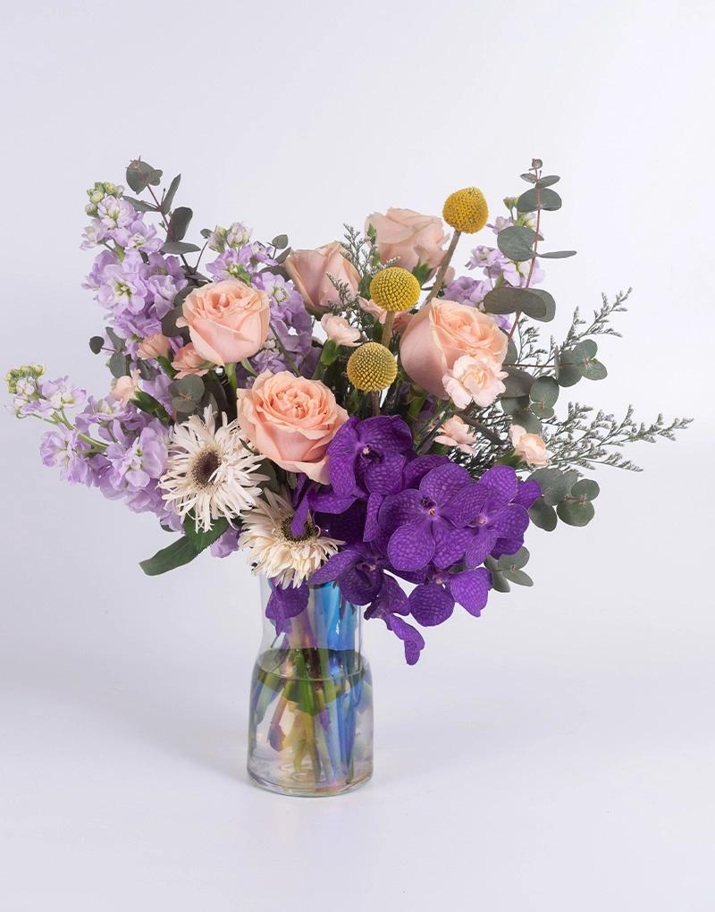 แจกันดอกไม้โทนสีม่วงชมพู จากร้าน Love You Flower แทนคำขอบคุณ หรือแสดงความยินดี เต็มไปด้วยความรักและความห่วงใย คุ้มค่า ราคาถูก