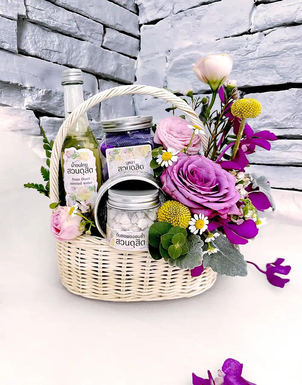 BS006 Fresh flower basket with Thai scented water set, adorned with purple flowers.